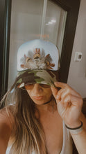 Load image into Gallery viewer, Feather Trucker Hat with Brass Rivet, Woman&#39;s Western Cowgirl Camo Foam Snapback w/ Rope detail, Boho Rodeo Cap, Pheasant Feather design on Camouflage cap
