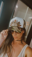 Load image into Gallery viewer, Feather Trucker Hat with Brass Rivet, Woman&#39;s Western Cowgirl Camo Foam Snapback w/ Rope detail, Boho Rodeo Cap, Pheasant Feather design on Camouflage cap
